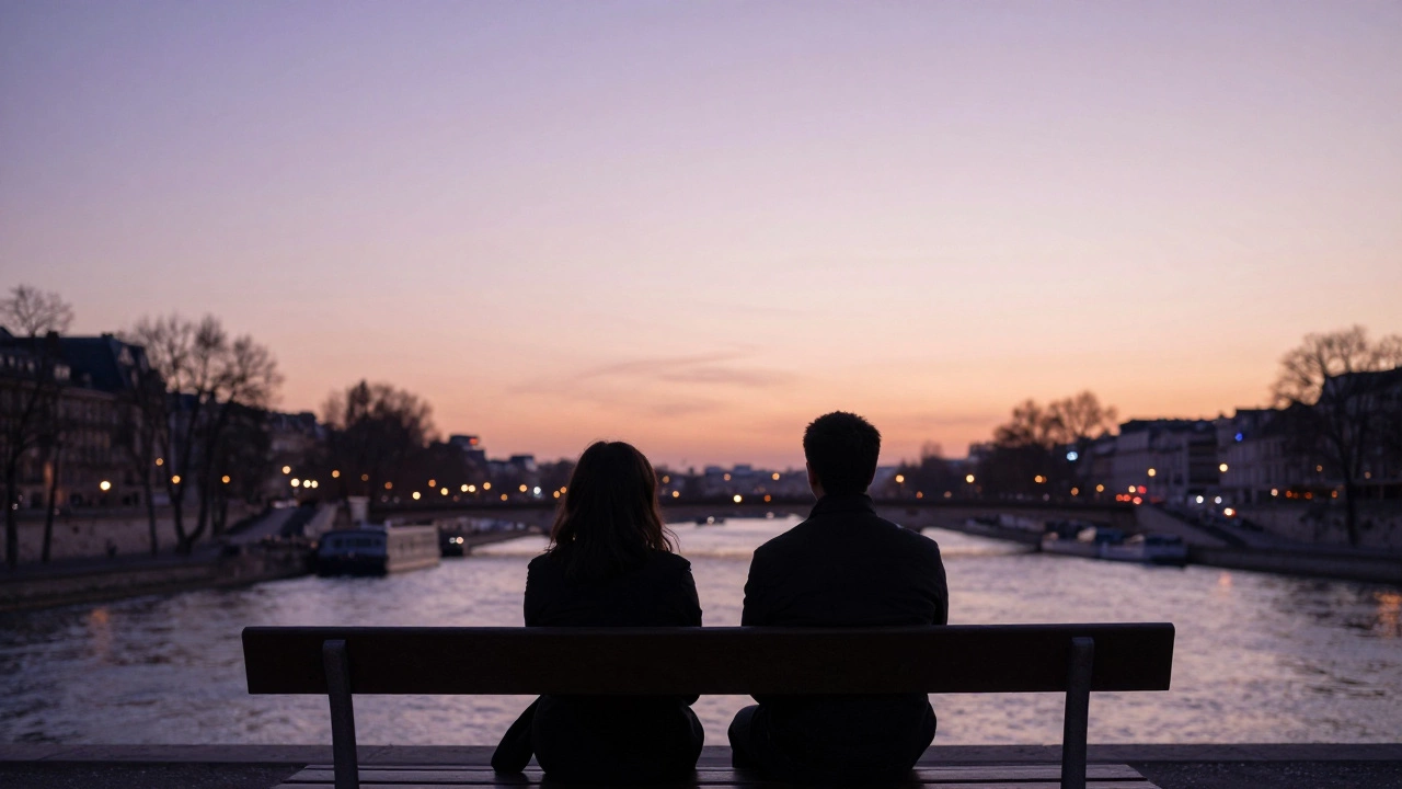 Two figures sit in peaceful silence on a bench at Trocadéro, watching the sunset over the Seine.